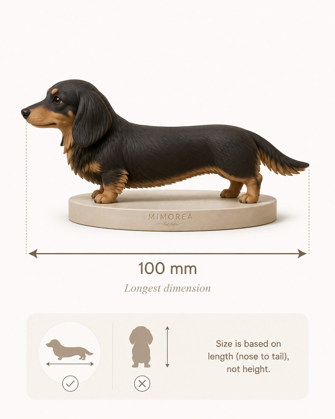 A long-bodied dachshund figure with a 100 millimetre measurement from nose to tail.